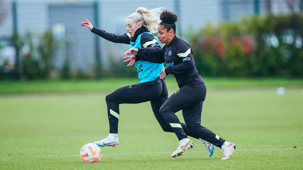 WING BATTLE : Chloe Kelly tries to dribble past full-back Demi Stokes