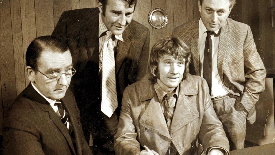 TRUE BLUE: Eric Alexander is pictured (far right) alongside former City secretary Walter Griffiths (left) and manager Malcolm Allison as Rodney Marsh signs for City in 1972