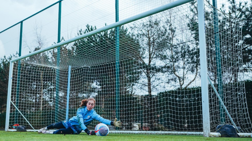 DOWN LOW : Sandy MacIver dives for the ball