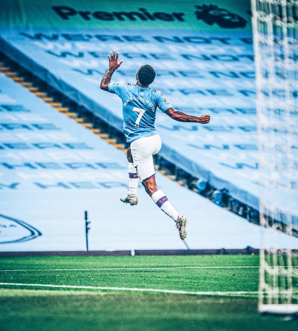 JUNE 17 : Raheem Sterling celebrates his opener in front of an empty stand, with the words Black Lives Matter replacing players’ names as football stands shoulder to shoulder with the global movement seeking racial equality. 