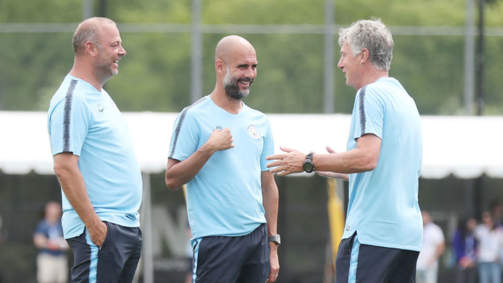 ALL SMILES: Brian shares a light-hearted moment with manager Pep Guardiola and fellow assistant coach Rodolfo Borrell