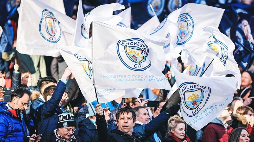 FLYING THE FLAG: Fans get into the big match spirit at the recent Carabao Cup final