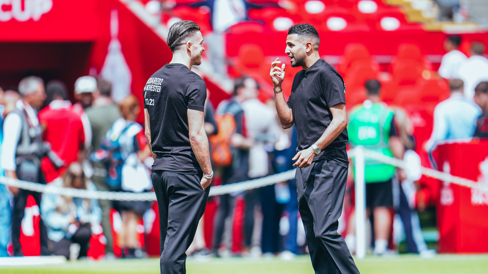 DYNAMIC DUO : Mahrez and Grealish share a word on the pitch after arrival.