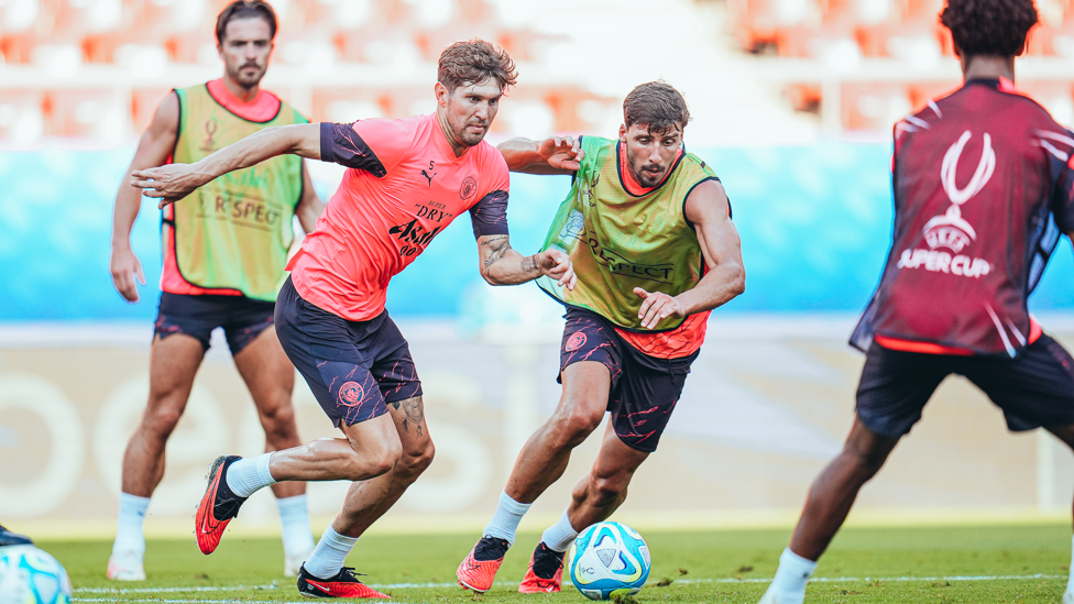 DUELLING DEFENDERS : John Stones and Ruben Dias fighting for possession. 