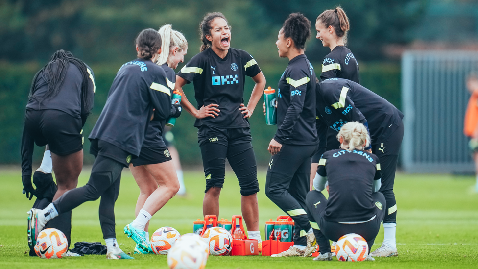 WHAT'S SO FUNNY? : A joke is shared between the players during a drinks break.