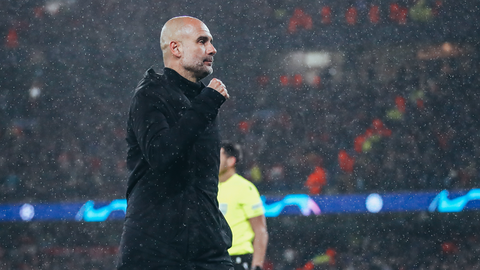 PROUD PEP: The Boss looks to his bench to celebrate as City take control.