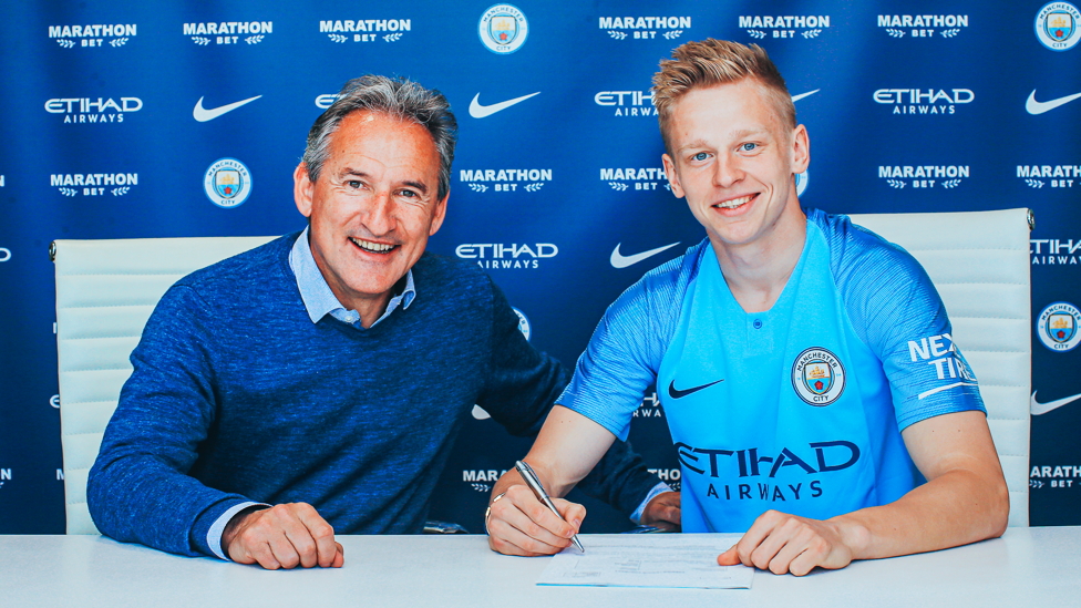 ALL SMILES: Zinchenko and director of football Txiki Begiristain after the Ukrainian signed a new contract in the summer of 2019