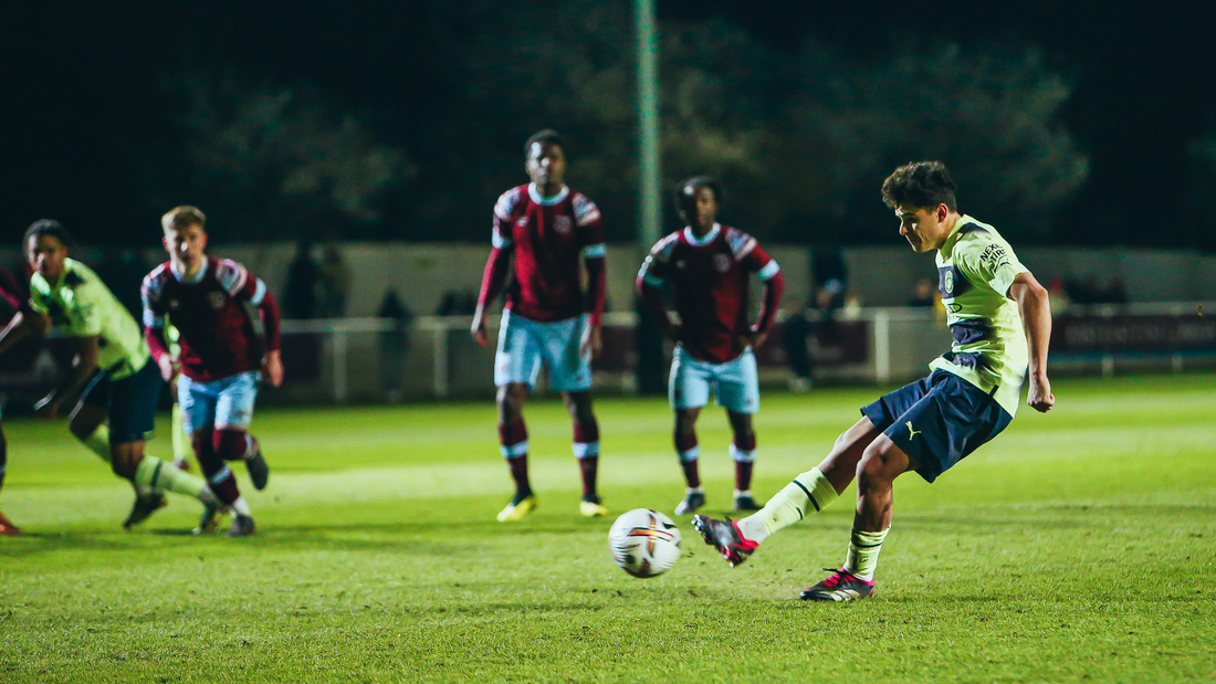 RUN UP: Alex Robertson steps up to take the penalty.