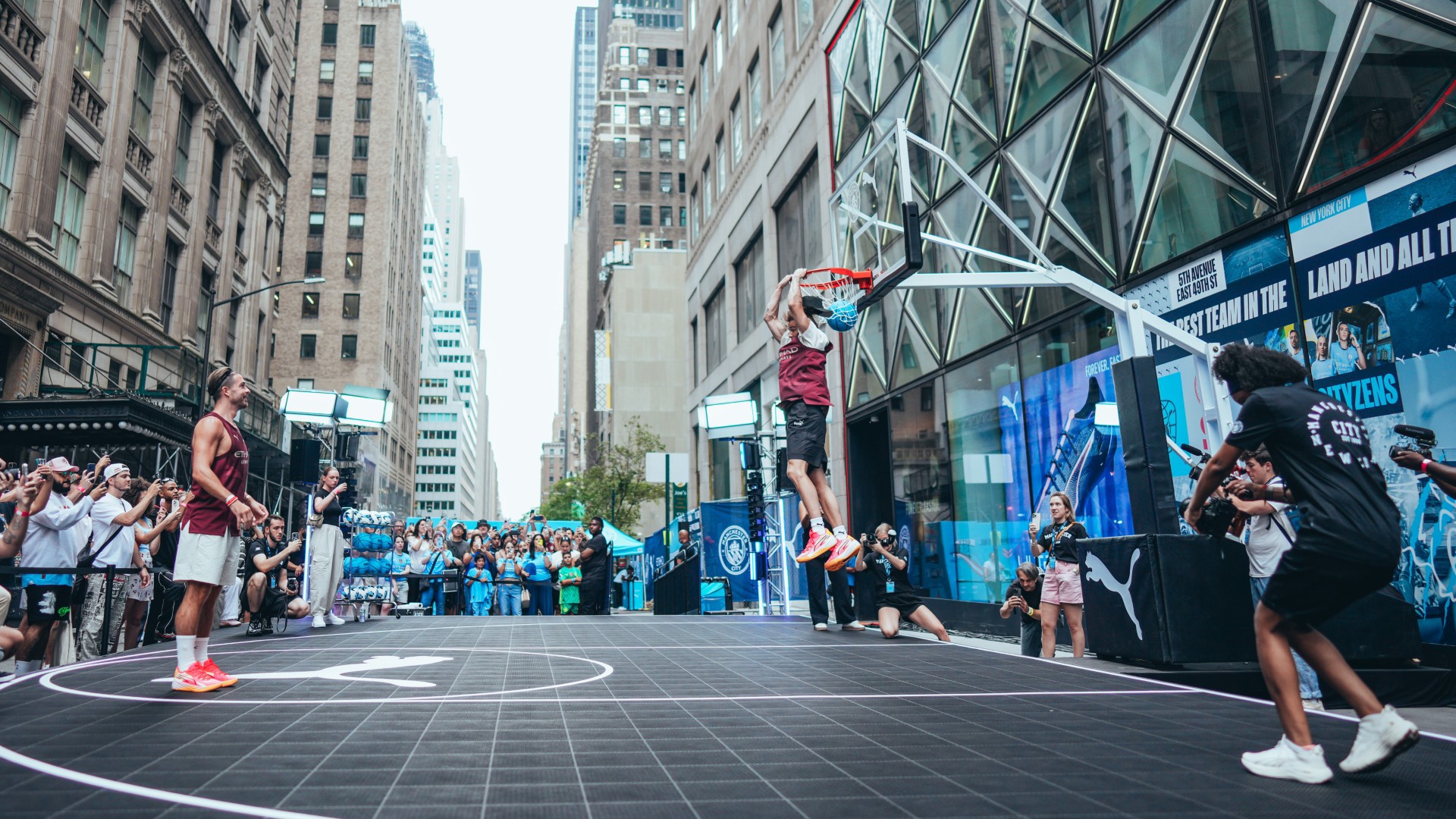 Man City star beam as he plays street basketball in New York in special outfit