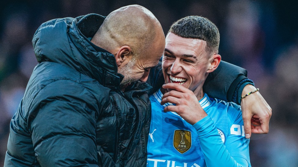 ALL SMILES : Pep and Phil Foden after the win over Huddersfield