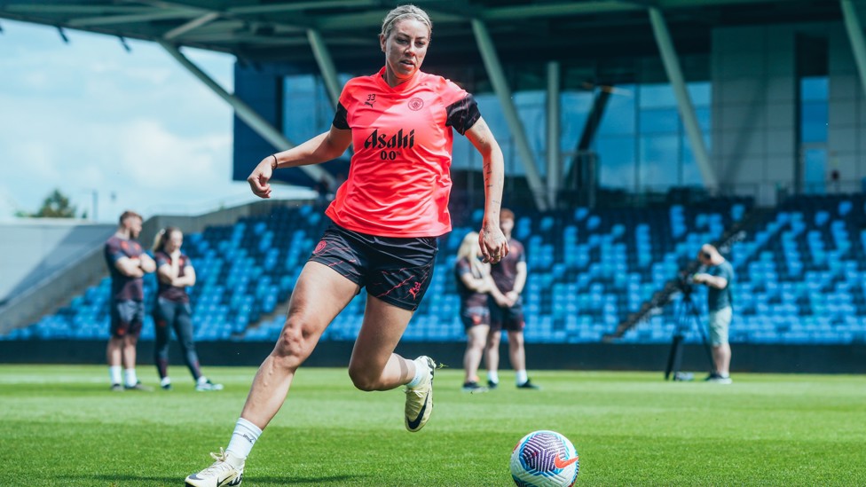 DARTING DEFENDER  : Alanna Kennedy drives with the ball. 