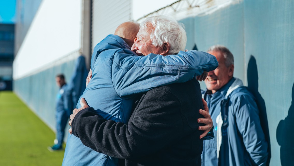 Training: Players are greeted by Mike Summerbee