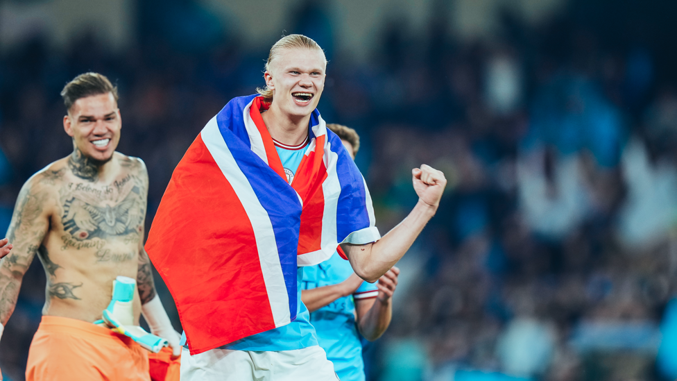 OUR NORWEIGAN : Erling Haaland drapes the Norway flag over his shoulder as he celebrates reaching his first Champions League final.