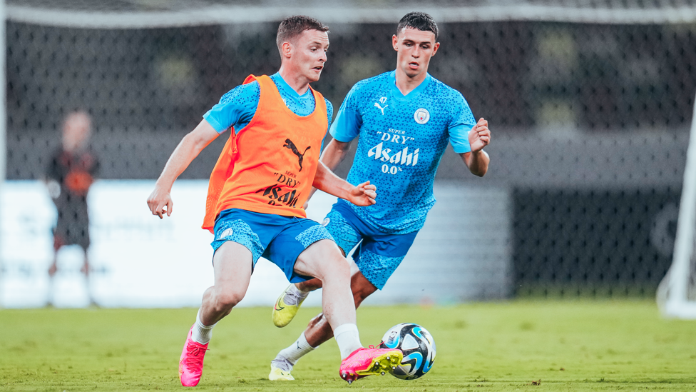 AT CLOSE QUARTERS: Sergio Gomez and Phil Foden contest possession