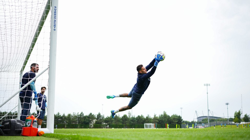 SPRING : Ederson makes a great save.