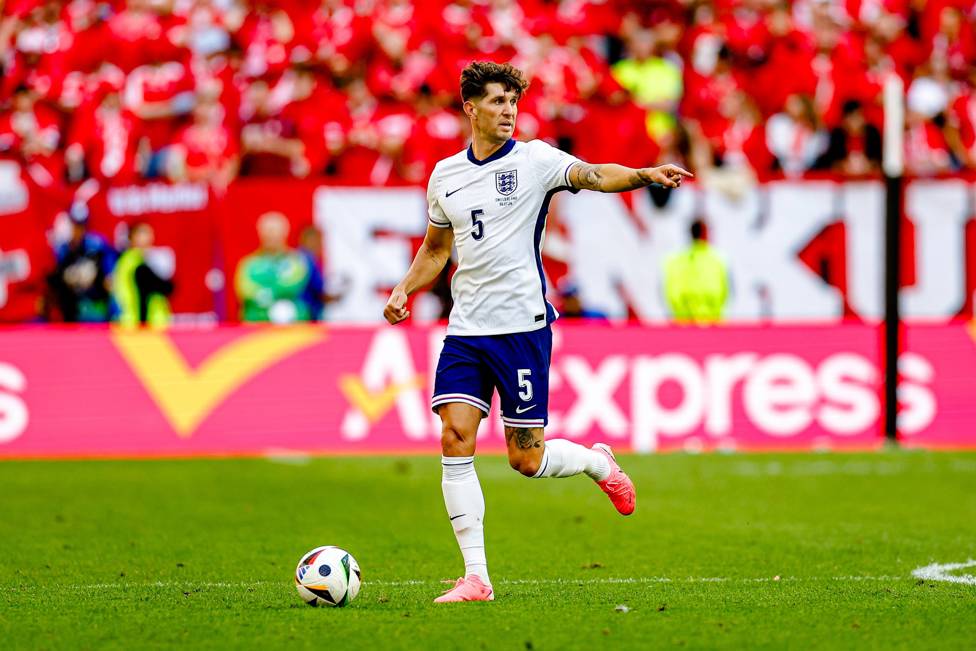 SUPER STONES : John offered our instructions while on the ball in England's game against Switzerland.