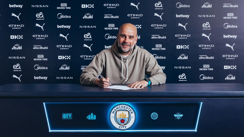 THE JOURNEY CONTINUES : Pep Guardiola all-smiles as he signs a new two-year contract extension with City, meaning he will spend more than a decade as manager.