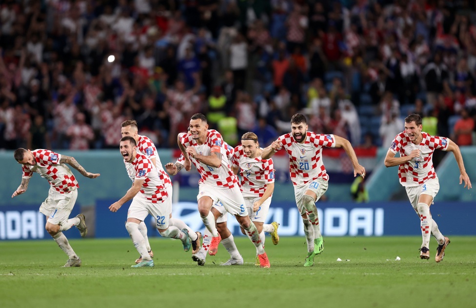 PENALTY DELIGHT: :  Gvardiol and his Croatia team mates celebrate winning the penalty shoot-out against Japan in the World Cup Round of 16 -