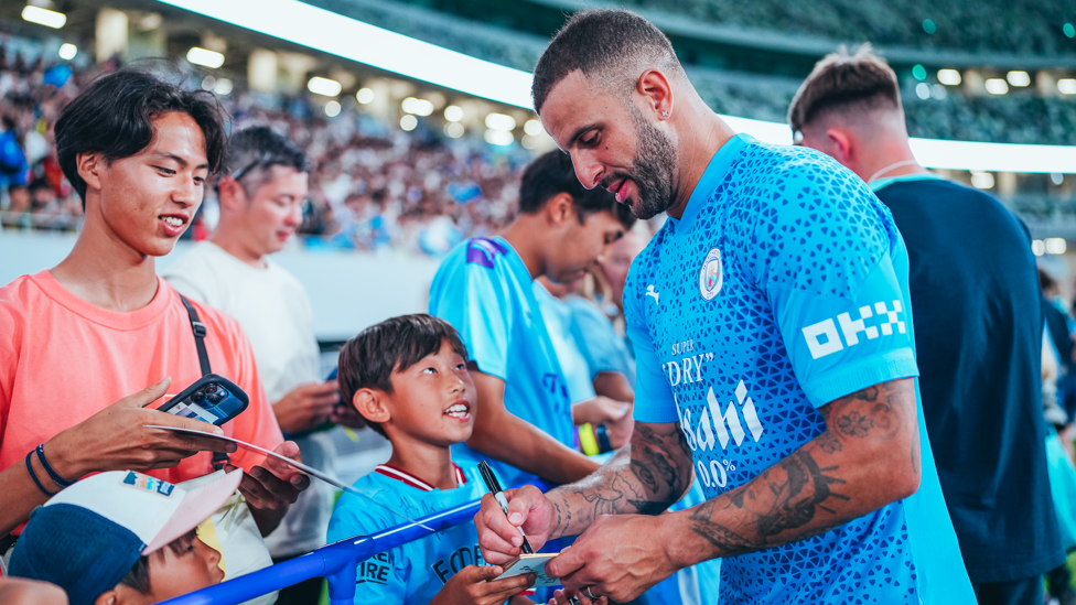 SIGN HERE: Kyle Walker makes these supporters' day!