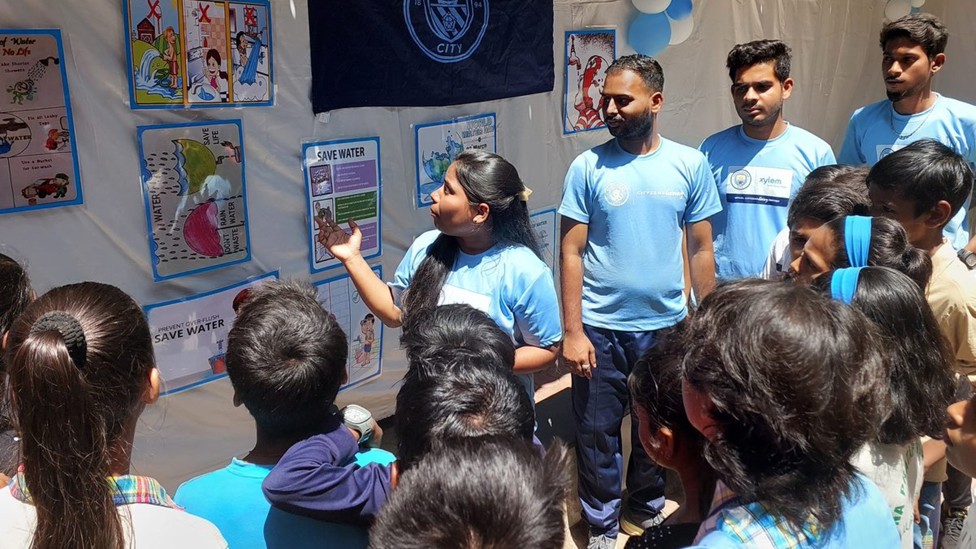 Young Leaders in Mumbai educate local children on water messages, before leading on-pitch football and WASH sessions.