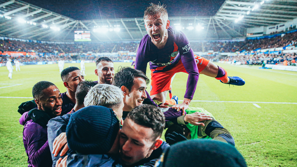 JUMPING FOR JOY: Zinchenko and City celebrate a dramatic FA Cup quarter-final comeback win at Swansea in 2019