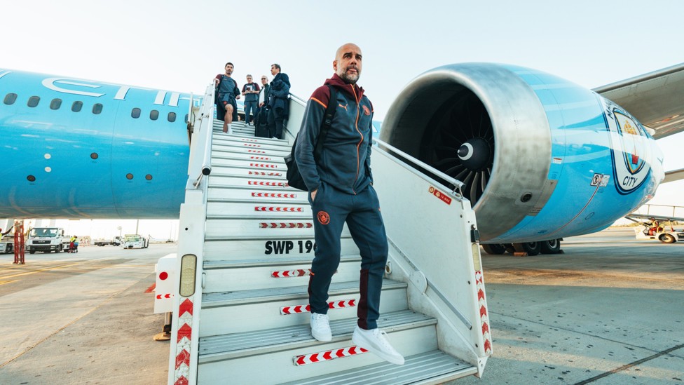 LANDED  : Pep Guardiola exits the plane in Saudi Arabia.