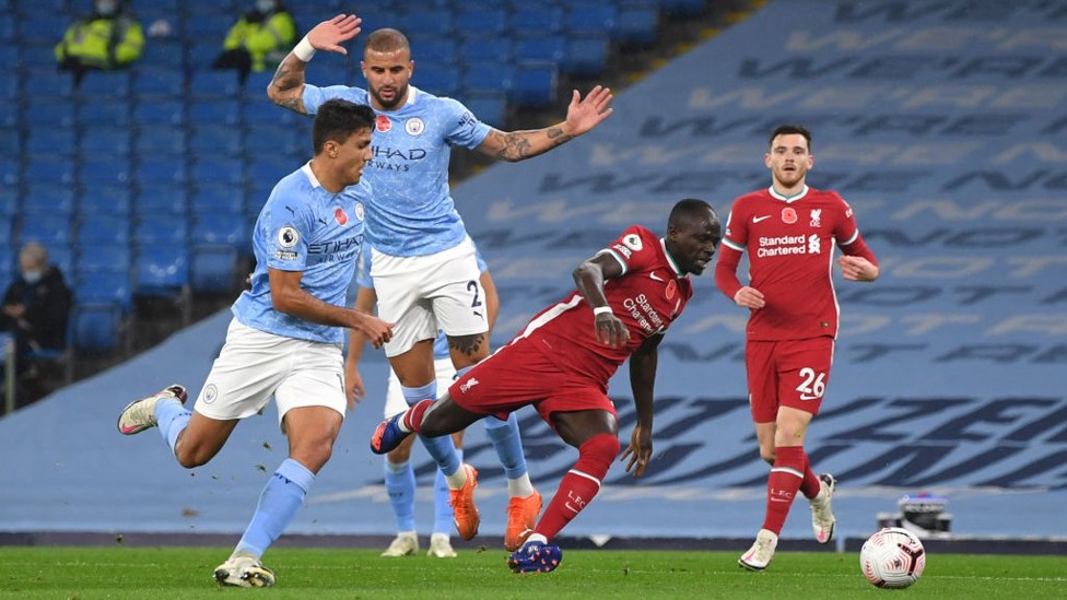 PENALTY: Referee Craig Pawson felt Sadio Mane was brought down by Kyle Walker