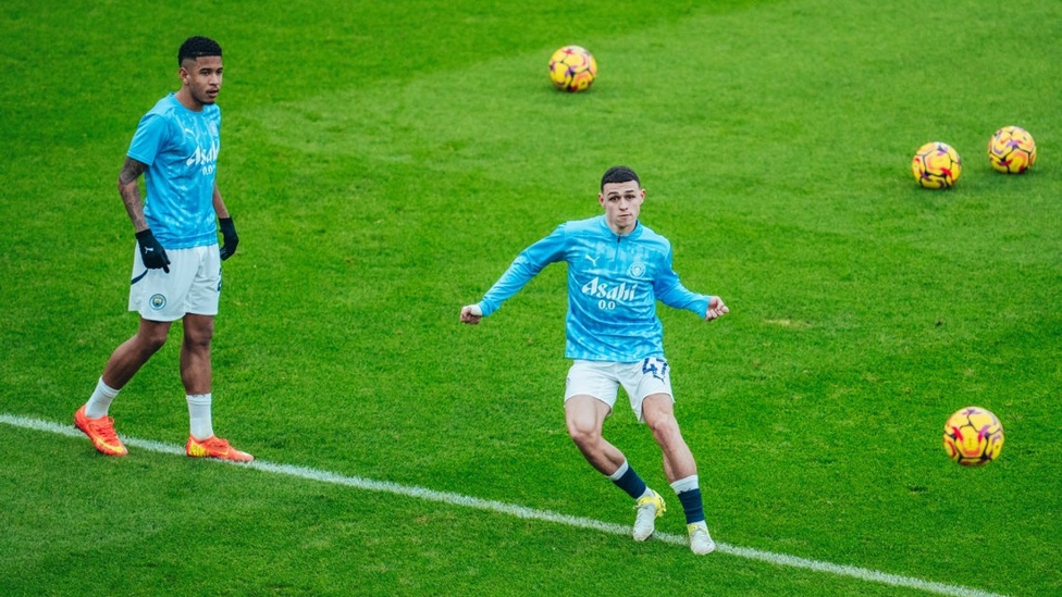 PHIL-ING GOOD: Foden gets in the mood during the pre-match warm up.