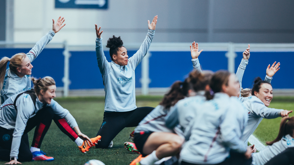 LIMBERING UP : The team take part in some pre-training stretches