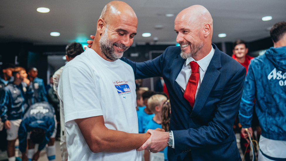 BOSSES : Guardiola and Ten Hag share a warm embrace ahead of kick off.