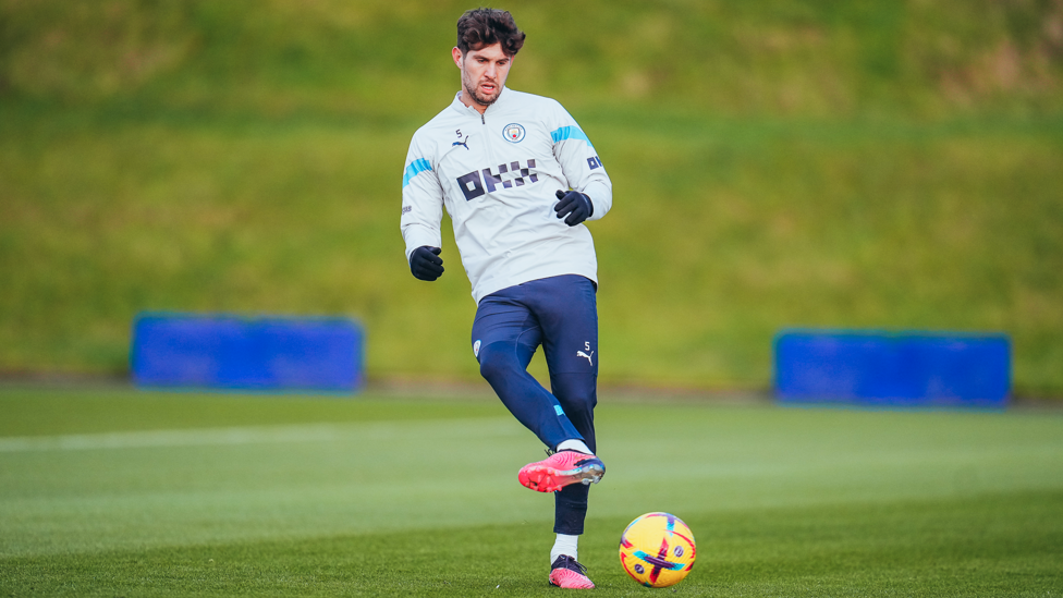 STONE WALL : John Stones passes the ball during the session