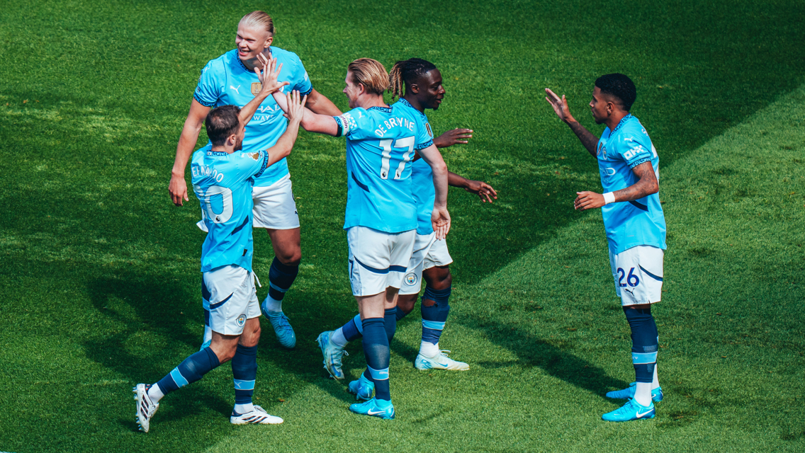 HIGH FIVES: The players celebrate the second goal.