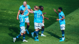 HIGH FIVES: The players celebrate the second goal.