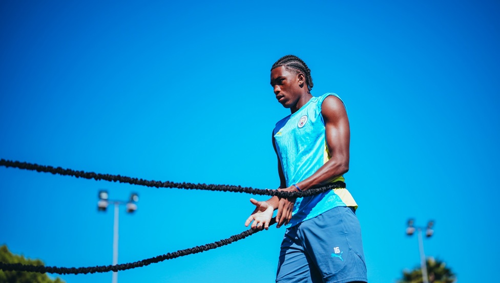 More stretching! : Reigan Heskey against a brilliant blue sky