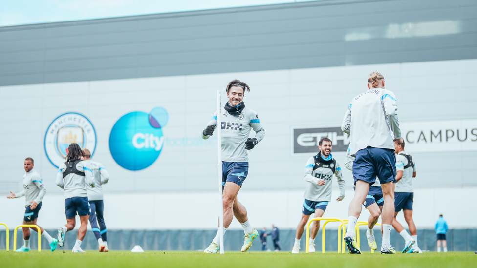 JUMPING JACK: Winger Jack Grealish was in great spirits as City went about their work.