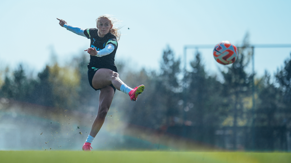 STRIKE : Chloe Kelly fires towards goal