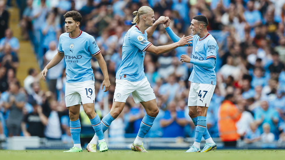 CREATOR AND SCORER : Haaland and Foden celebrate after linking up for the equaliser.