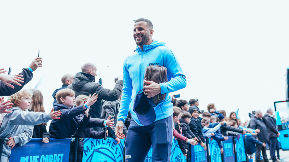 WALK IN : Kyle arrives at the stadium in fine spirits.