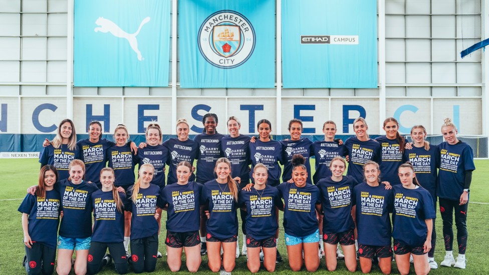 MARCH OF THE DAY  : City's players wear t-shirts to promote the upcoming fundraising event for the MND Foundation.