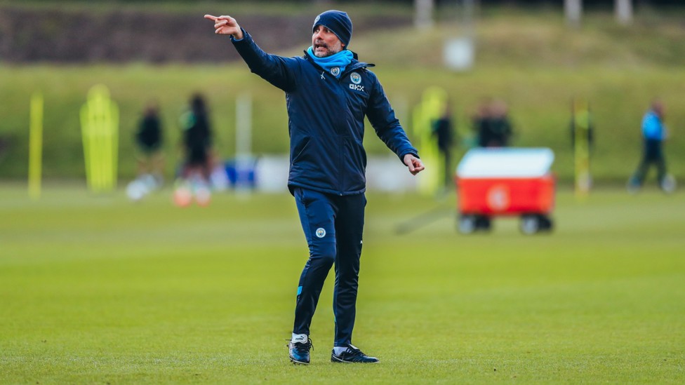 IN CHARGE : Pep Guardiola delivers his instructions to his players