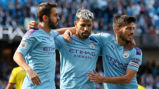 CENTRE OF ATTENTION: Bernardo and David Silva salute Sergio Aguero after his 100th goal at the Etihad