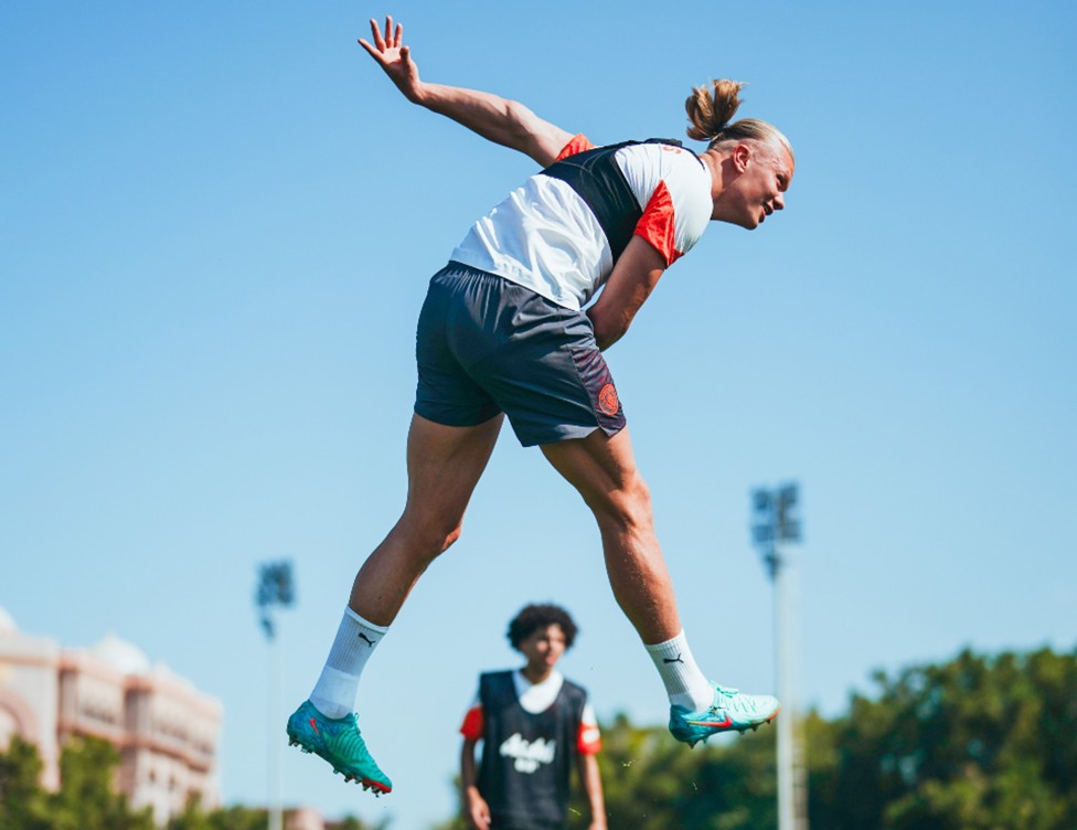 UP AND AT 'EM: Erling Haaland takes to the Abu Dhabi skies.