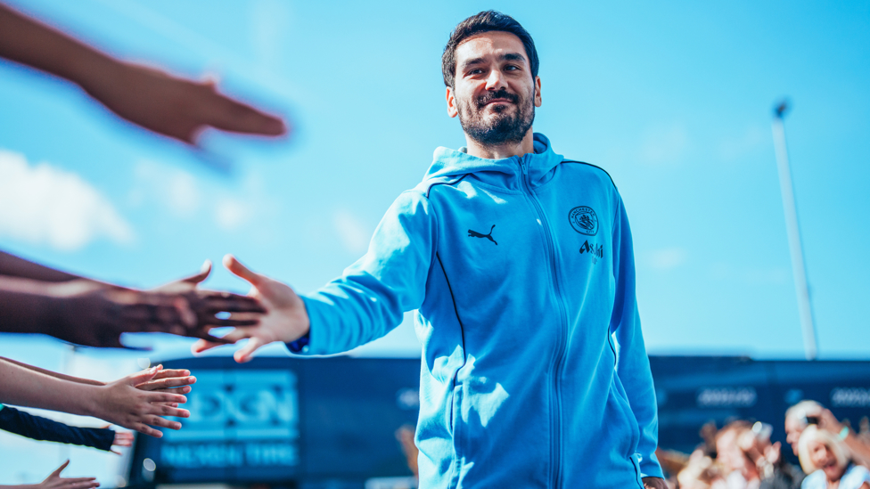 GREETING GUNDO : High-fives on the way into the Etihad Stadium.