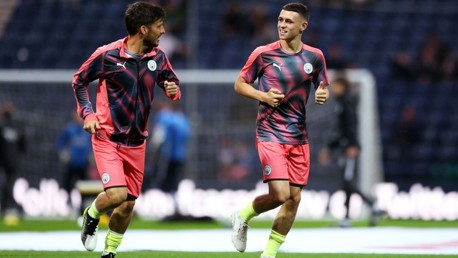 DUO: Phil Foden and David Silva warm up together.