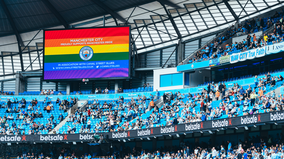 Stadium screens display the Pride flag