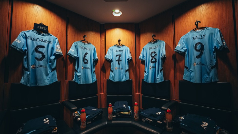 SQUAD  : City's shirts hanging in the changing room. 