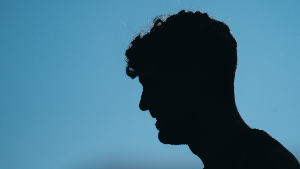 STONES SHADOW : A moody shot of John Stones 