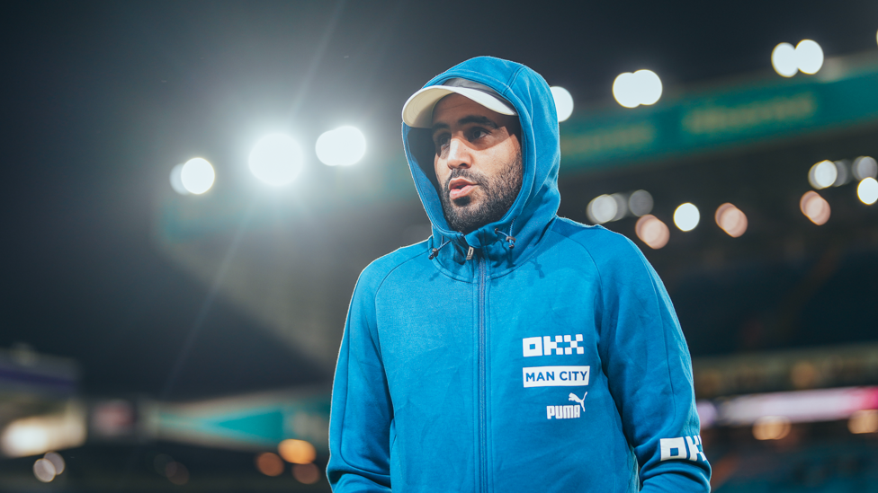 ARRIVAL : Mahrez arrives at the chilly stadium.