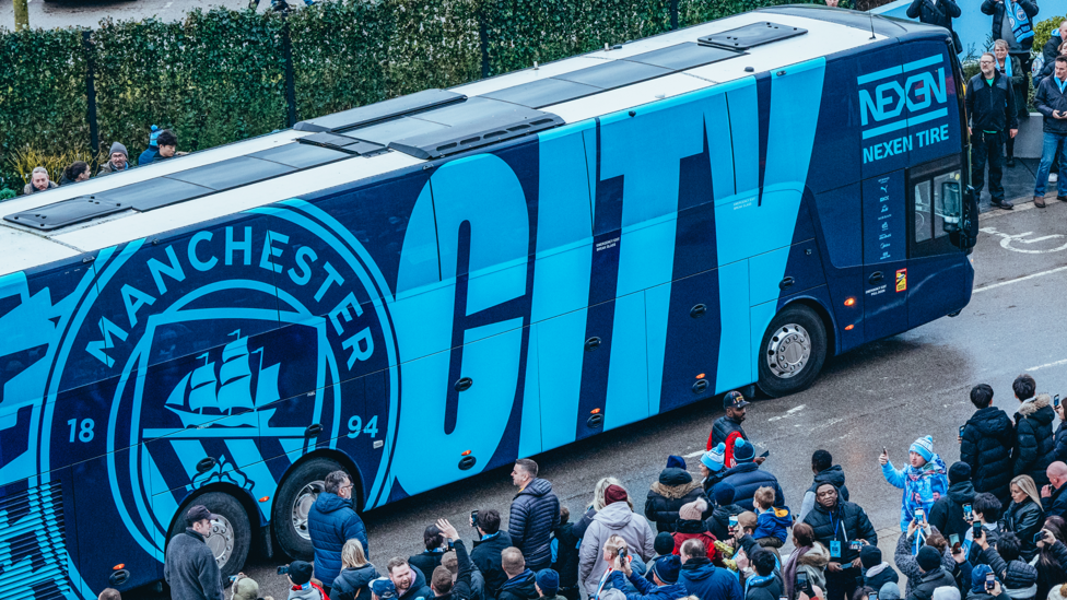 CHAMPIONS OF THE WORLD RETURN HOME: City supporters await the return of the team as the bus arrived