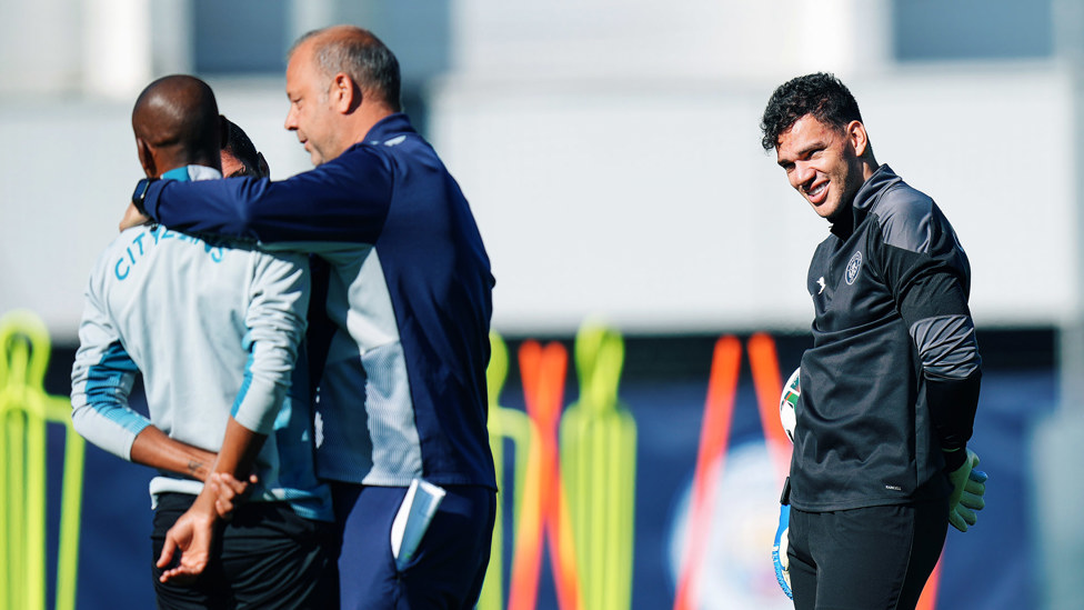 SMILES BETTER: Ederson was in great spirits as coach Rodolfo Borrell took time out for a light hearted moment with Fernandinho